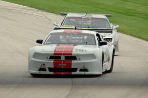 Tony Ave's Ford Mustang and Adam Andretti's Chevy Camaro