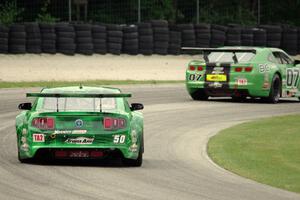 Bruce Nesbitt's Ford Mustang chases Jordan Bernloehr's Chevy Camaro