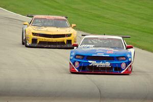 Lawrence Loshak's Ford Mustang and John Atwell's Chevy Camaro