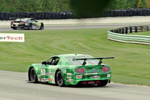 Bruce Nesbitt's Ford Mustang chases Steven Lustig's Ford Mustang