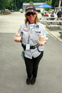 Lisa Simoni double-fists ice cream from the St. John the Baptist's concession.