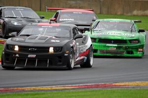 Todd Napieralski's Chevy Camaro, Bruce Nesbitt's Ford Mustang, Chuck Cassaro's Ford Mustang and