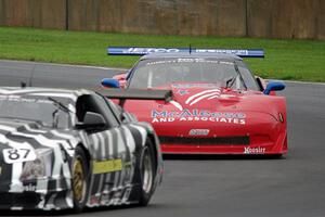 Jim McAleese's Chevy Corvette chases Doug Peterson's Cadillac CTS-V