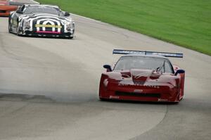 Jim McAleese's Chevy Corvette leads Doug Peterson's Cadillac CTS-V in the closing laps.