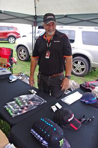 Mike Durbin sells Trans-Am hats and shirts in the paddock.