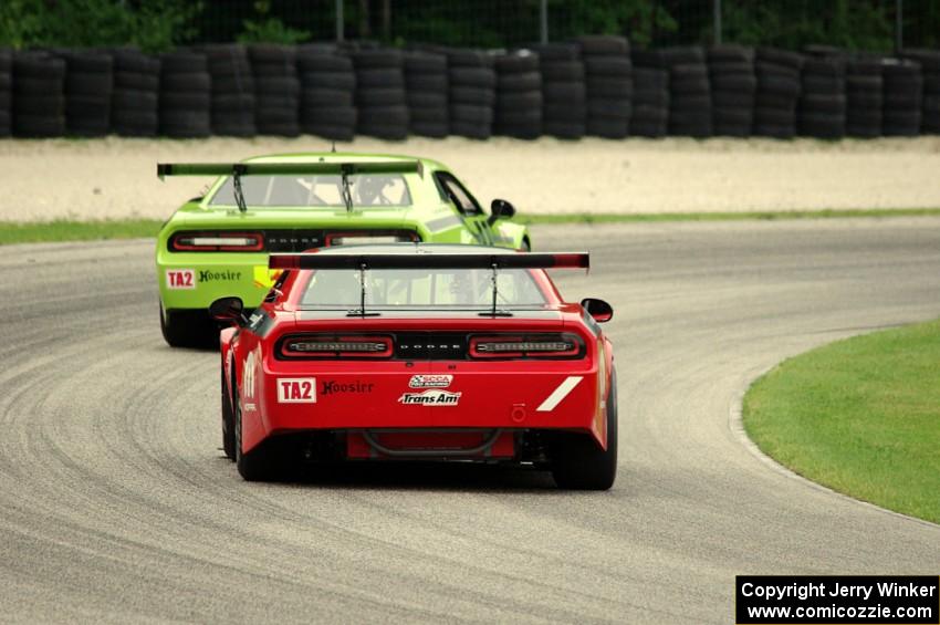 Cameron Lawrence's Dodge Challenger chases Joe Stevens' Dodge Challenger