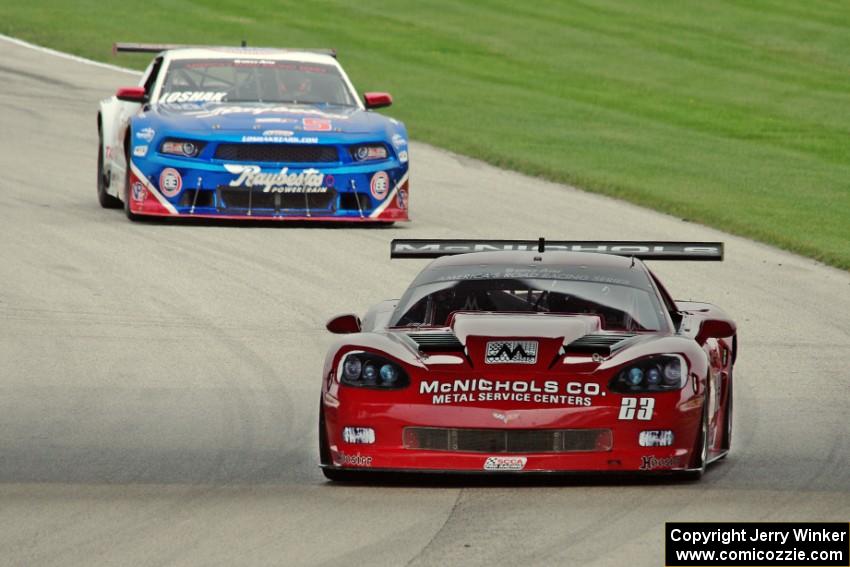 Amy Ruman's Chevy Corvette and Lawrence Loshak's Ford Mustang