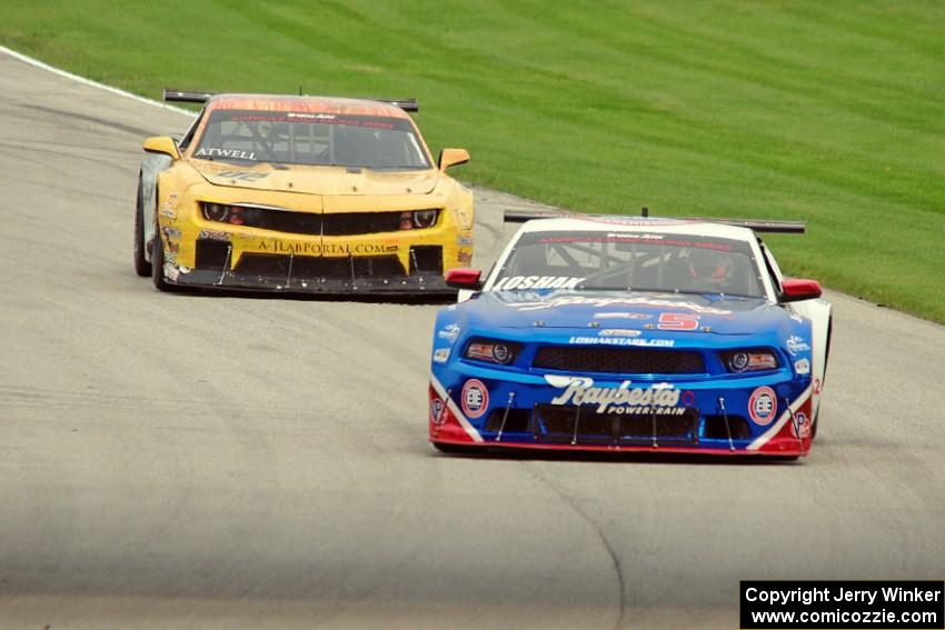 Lawrence Loshak's Ford Mustang and John Atwell's Chevy Camaro