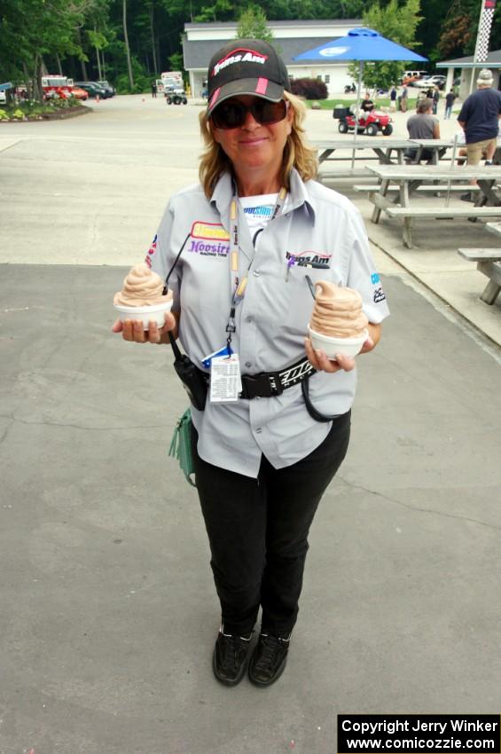 Lisa Simoni double-fists ice cream from the St. John the Baptist's concession.