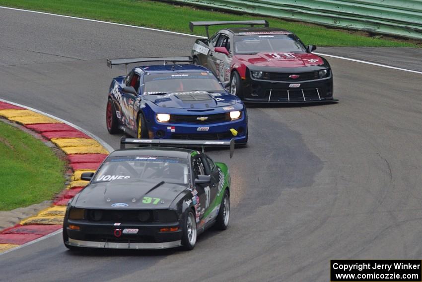 Rich Jones' Ford Mustang, Fernando Seferlis' Chevy Camaro and Bill Baten's Chevy Camaro