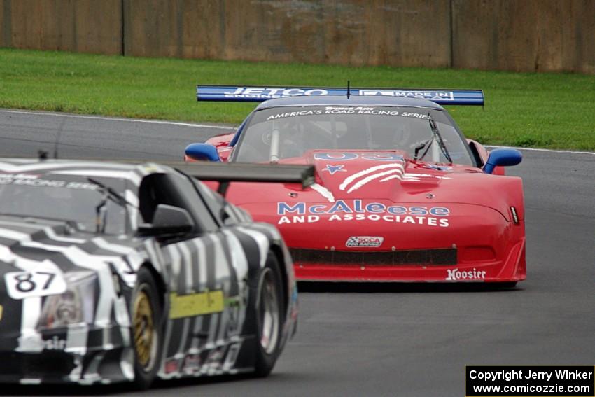 Jim McAleese's Chevy Corvette chases Doug Peterson's Cadillac CTS-V