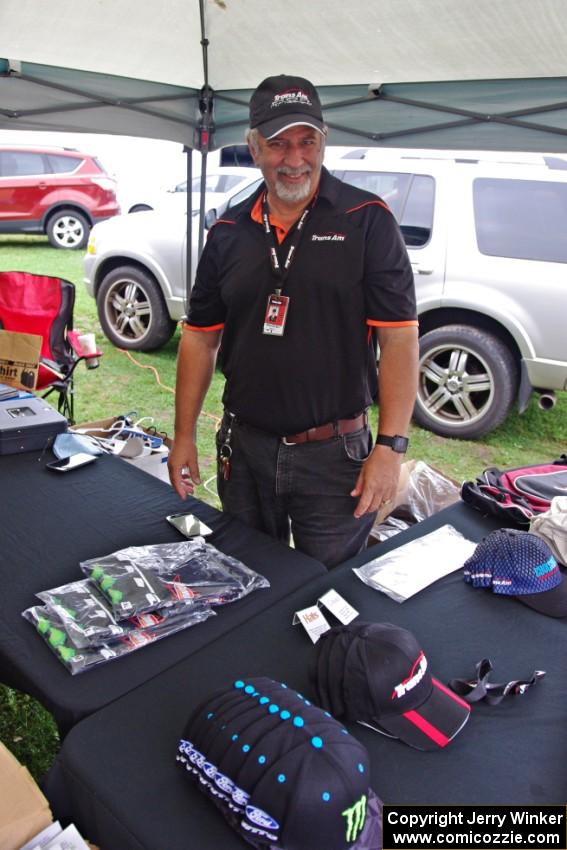 Mike Durbin sells Trans-Am hats and shirts in the paddock.