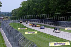 The first race ends under yellow condtions behind the pace car.