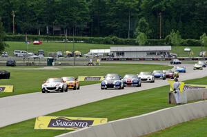 The first race ends under yellow condtions behind the pace car.