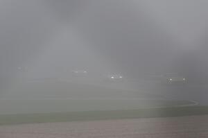 The second race starts under yellow flag conditions, behind the pace car, due to thick fog.