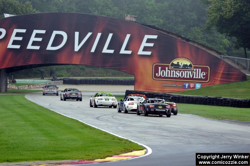 MX-5s head out of turn 8 into the carousel.