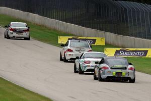 The next four ST cars head into turn 5.