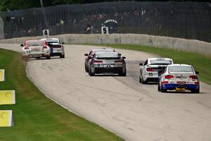 B.J. Zacharias / Brad Jaeger Nissan 370Z is nearly forced off by Jade Buford / Austin Cindric Ford Mustang Shelby GT350R-C