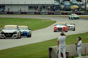 Five more ST cars come out of turn 3.