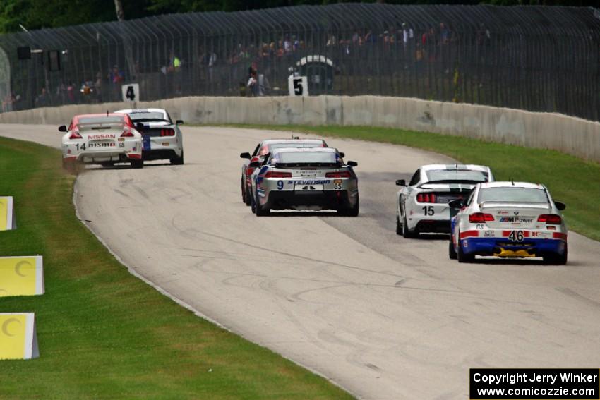 B.J. Zacharias / Brad Jaeger Nissan 370Z is nearly forced off by Jade Buford / Austin Cindric Ford Mustang Shelby GT350R-C