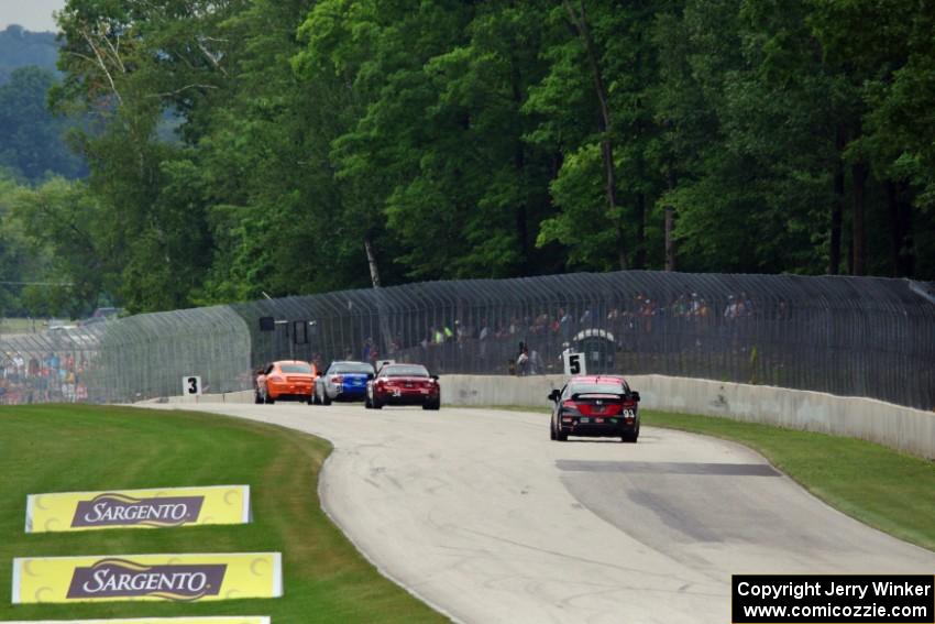 The lead four ST cars head into turn 5.