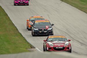 Christian Szymczak / Justin Piscitell Mazda MX-5, Chad Gilsinger / Ryan Eversley Honda Civic Si and Jeff Mosing / Eric Foss