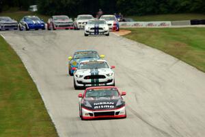 B.J. Zacharias / Brad Jaeger Nissan 370Z leads the pack of GS cars after the first yellow.