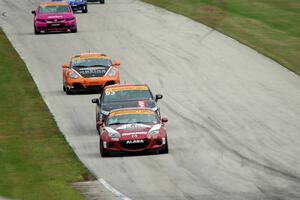 The ST leaders come down the hill into turn 8.