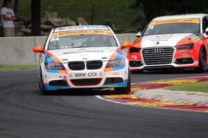 Ted Giovanis / David Murry BMW 328i and Jim McGuire / Nico Rondet Audi S3