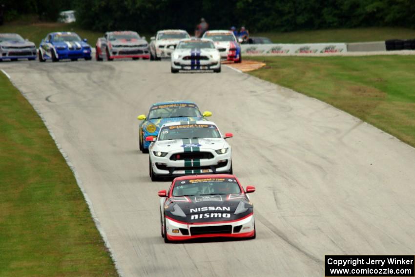 B.J. Zacharias / Brad Jaeger Nissan 370Z leads the pack of GS cars after the first yellow.