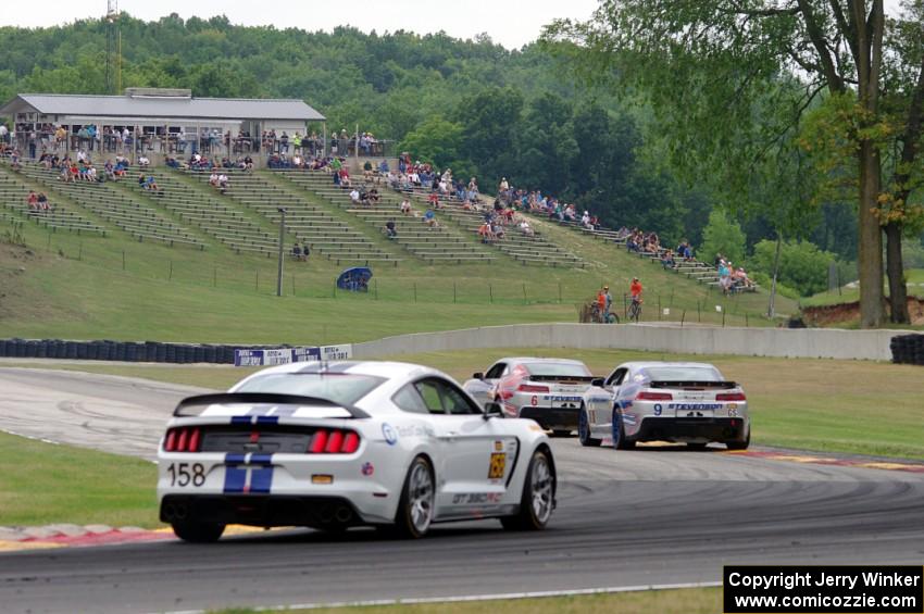 Andrew Davis / Robin Liddell and Lawson Aschenbach / Matt Bell Chevy Camaro Z/28.Rs with Jade Buford / Austin Cindric Ford Musta