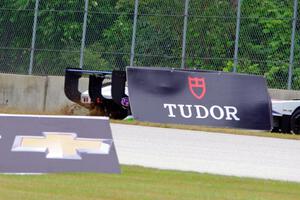 Michal Chlumecky's Panoz Élan DP-02 tags the outside wall at turn 2.