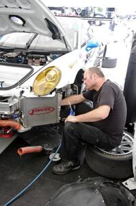 Dave Clark works on the Cooper MacNeil / Leh Keen Porsche GT3 Cup.