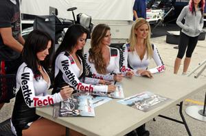 The WeatherTech girls sign autographs.