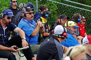 Spotters in the grandstands at turn 1.