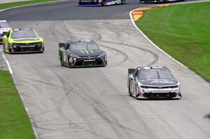 Brian Scott's Chevy Camaro, Boris Said III's Toyota Camry and Paul Menard's Chevy Camaro