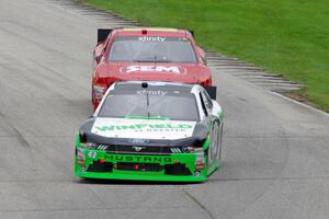 Dakoda Armstrong's Ford Mustang and Lawson Aschenbach's Chevy Camaro