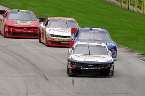 Dylan Kwasniewski's Chevy Camaro, Elliott Sadler's Ford Mustang, Andy Lally's Chevy Camaro and Michael Self's Chevy Camaro