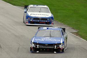 Ty Dillon's Chevy Camaro and Chris Buescher's Ford Mustang