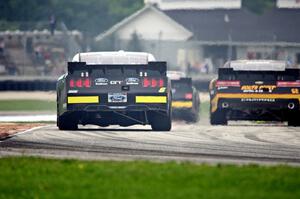 Darrell Wallace, Jr.'s Ford Mustang and Brendan Gaughan's Chevy Camaro