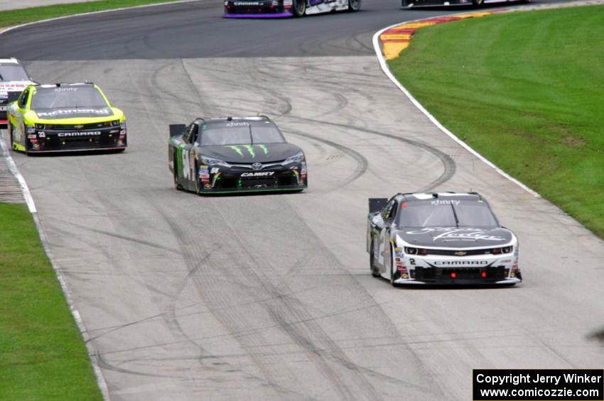 Brian Scott's Chevy Camaro, Boris Said III's Toyota Camry and Paul Menard's Chevy Camaro