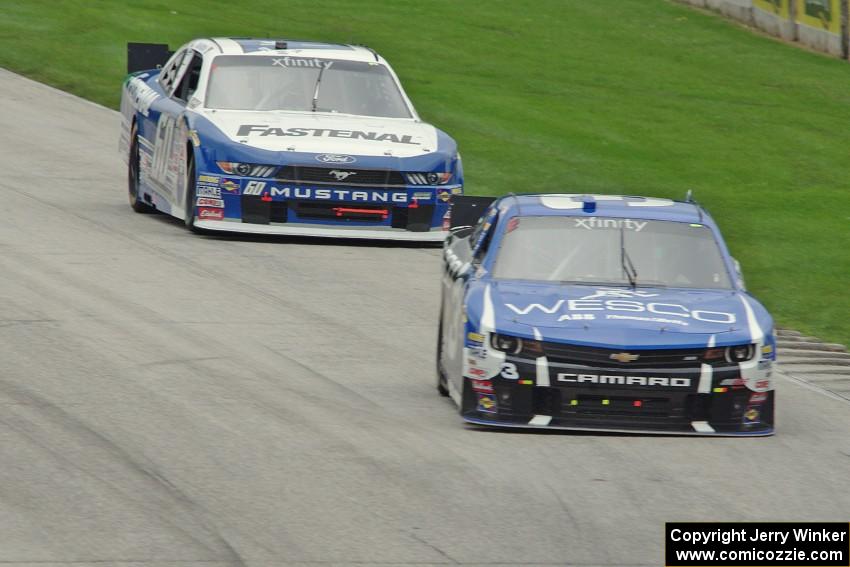 Ty Dillon's Chevy Camaro and Chris Buescher's Ford Mustang