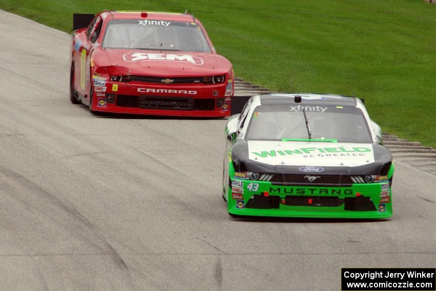 Dakoda Armstrong's Ford Mustang and Lawson Aschenbach's Chevy Camaro