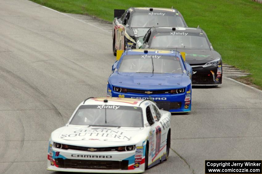 Kevin O'Connell's Chevy Camaro, Ryan Sieg's Chevy Camaro, David Starr's Toyota Camry and Stanton Barrett's Ford Mustang