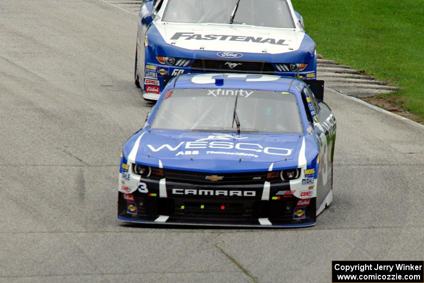 Ty Dillon's Chevy Camaro and Chris Buescher's Ford Mustang