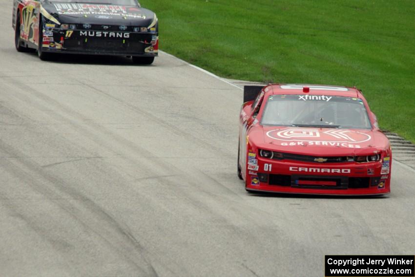 Ross Chastain's Chevy Camaro and Stanton Barrett's Ford Mustang