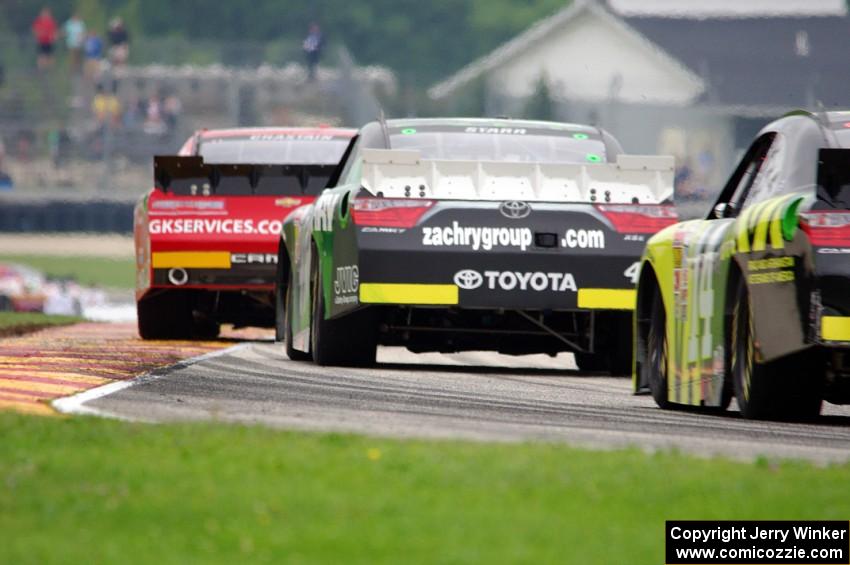 Ross Chastain's Chevy Camaro, David Starr's Toyota Camry and Cale Conley's Toyota Camry