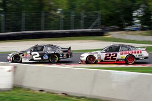 Brian Scott's Chevy Camaro and Ryan Blaney's Ford Mustang