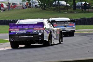 Justin Marks' Chevy Camaro chases Chris Buescher's Ford Mustang