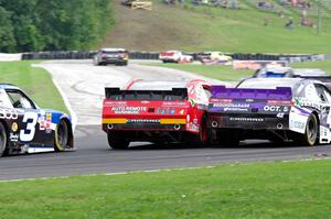 Michael Self's Chevy Camaro nudges Justin Marks' Chevy Camaro as Ty Dillon's Chevy Camaro follows.